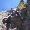 Christa Cline at the crux move left by the second bolt.