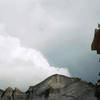 On the summit, with storms moving in, from false summit above Sykes Sickle, Pagoda in background.