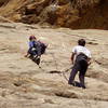 Christa Cline tip-toeing up the thin crack, belayed by Mike Amato.