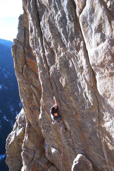 Through the boulder problem crux on Mile High Comic Crack.