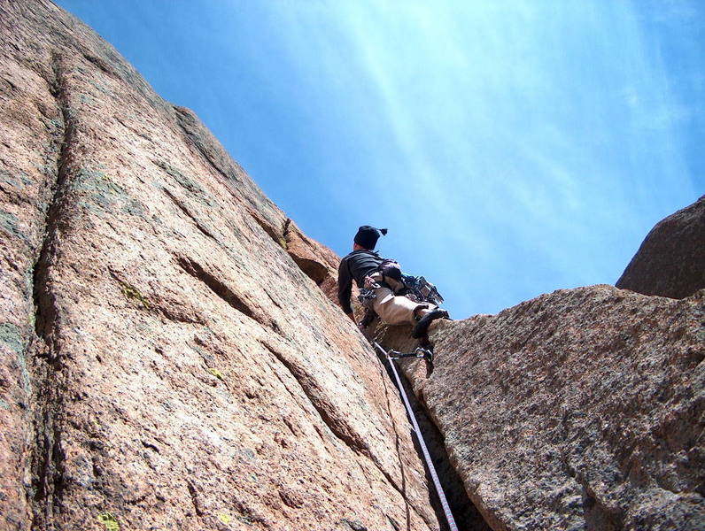 Shane looking up at the bad-ass handcrack of pitch three. 