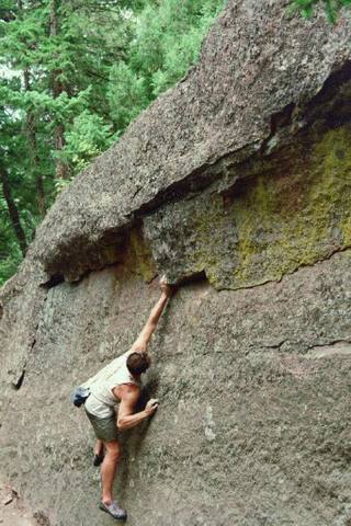 Chip Phillips reaching through the crux on Midrange, by Jen Tiahrt.