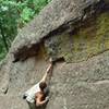 Chip Phillips reaching through the crux on Midrange, by Jen Tiahrt.