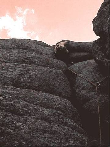 Curt Shea on the 8+ crux of "Big House," Upper Blair/Vedauwoo, Wyoming. 27 May, 2003. Photographed/belayed by Ben Boykin