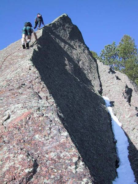 The final unprotected section from a belay at the horizontal crack.  Here Warren is being passed by some silly free soloist.