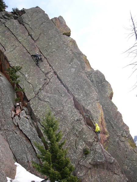 Cheating a bit (or am I?) approaching the first crux. Chuck Graves belaying. Paul Rezucha photograher.