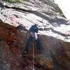 A bit ugly below the roof, and wet on this day. Nice rock above. Crux moves up and right from here over the hang.