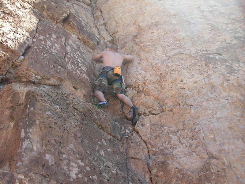 Devin ascends the lusty flanks of Risky Business for his first outdoor lead.