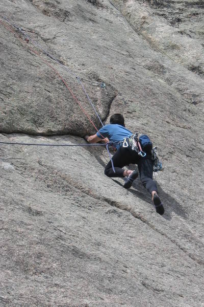 Pulling into the crux moves. The crux is over when you reach the holds at the piece above Chuck, but it's at about 5.9 pulling onto the stance, and then 10a or so above that.