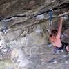 Picture of Micah Stocker climbing the great escape. Third bolt from the top.