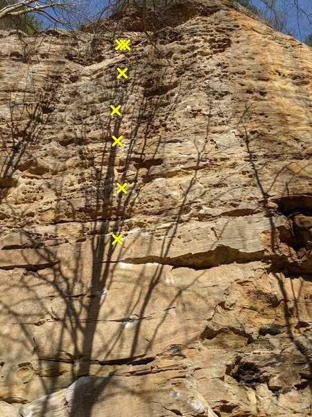 Inured Reserve 5.11a climbs the center line on this face.