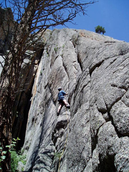 Just below the crux section. The Book of the Dead (9+) chimney is to the left. The huge Isis dihedal is just visible through the tree at the top left.