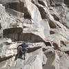 Mark heading up to the first crux roof on Moving Zen, Ra, Empire.