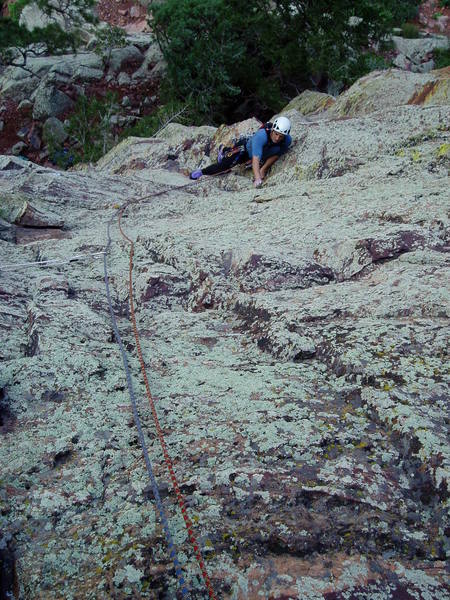 Following P1 10a. Above the 10a roof, this  pitch has a spot or two of 5.9 with sparse but adequate gear. The rock is pretty clean despite all the green in this photo.