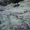 Following P1 10a. Above the 10a roof, this  pitch has a spot or two of 5.9 with sparse but adequate gear. The rock is pretty clean despite all the green in this photo.