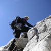 On the rock buttress near the upper right section of coulior.  About M2 in difficulty.