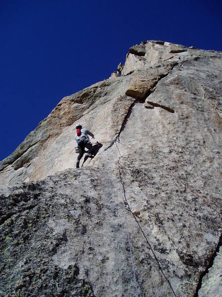 Starting the crux moves on P2. Chuck eventually got gear higher on the right with hopes of avoiding a fall onto the slab.