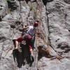 Christa Cline starting up Seein' Double. There are several solid moves past the first two bolts, then easier climbing up to the arete.