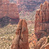 The follower is making her/his way up the last pitch of Fast Draw among the beautiful scenery of Colorado National Monument.