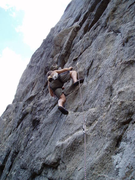 Above the crux on the popular 10a "first pitch".