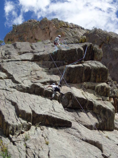 On the 10a crux. Lenny Miller belaying.