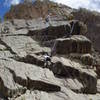 On the 10a crux. Lenny Miller belaying.