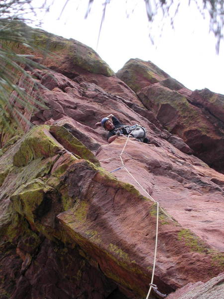 Mike Amato working to get pro halfway up the first pitch of Italian Arete.