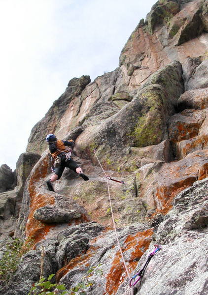 Yvonne D'Andrea approaching the crux bulge on the left variation of the third pitch.