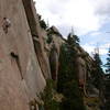 Ray, above the crux, with the mighty Crescent Arch in the background.