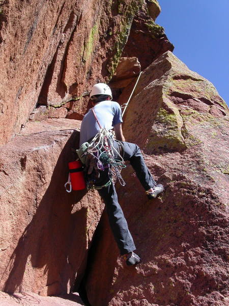 Mark laybacking the offwidth at the start of the third pitch.