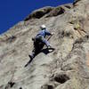 Moving right on the upper face. I keep angling up and right to good holds on the arete, but it's possible to climb straight up. We are top roping using the anchors on a recent Vaino Kodas route that is just left of Drop Zonee.<br>
<br>
Photo by Paul Rezucha.