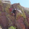 Bruno Hache cranking up to the hand crack on the second pitch.