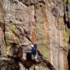 Hanging from an amazing little chockstone above the first overhang. The holds above and to my left are huge and incut. The first crux is getting from here to the diagonal buckets at the top left of the photo.
<br>

<br>
Photo by Chuck Graves.
