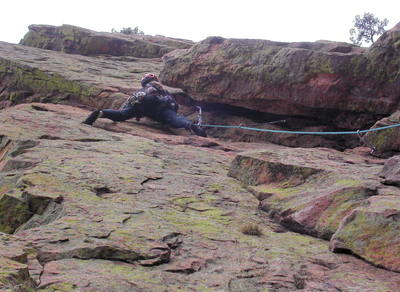 Christa Cline traversing under the roof on the third pitch.