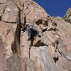 Bruno Hache low on the route.  He placed pro in the thin crack on the left, but is climbing to the right. <br>
<br>
Climbing the thin corner crack directly would up the difficulty far beyond 5.8.