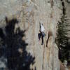 This climber did not know about moving left, and tried going straight up. It's possible--there are crimps--but much harder. He eventually went right.