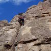 Approaching the ledge at the top of Alexi's Route. The route continues up and right to the Red Eclipse anchors.