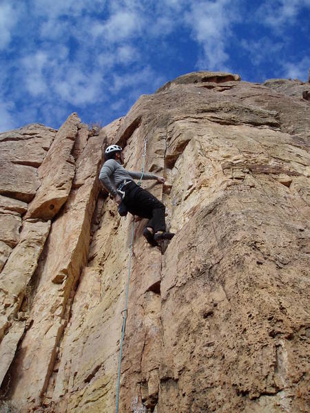 Starting the crux sequence. The bolt above Chuck is hard to clip. Layback to reach a jug, long reach to another jug, then a spooky standup.