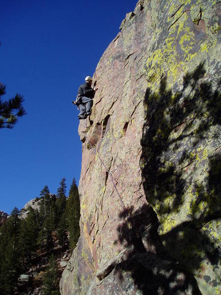 Almost done with the crux sequence. From here, step left to a jug, stand and stretch for a small flake, and clip the 3rd bolt.<br>
<br>
Photo by Ken Heiser.