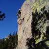 Almost done with the crux sequence. From here, step left to a jug, stand and stretch for a small flake, and clip the 3rd bolt.<br>
<br>
Photo by Ken Heiser.