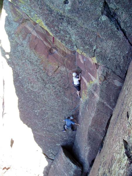 Jeff and ? and my shadow taken from the belay on Moonlight Drive. The climber in white was looking a big swing with his rope not clipped to any of the gear, but he was not concerned.