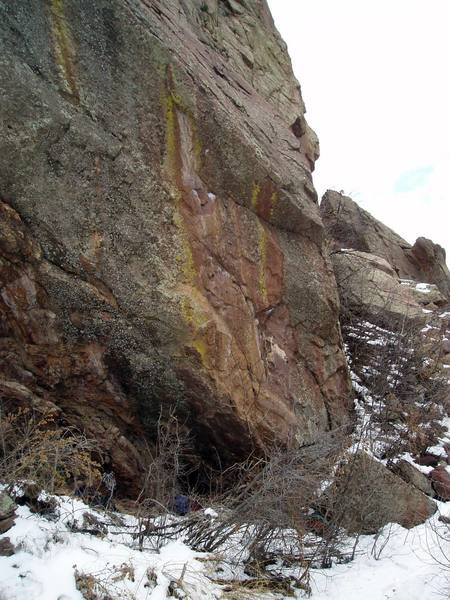 The route diagonals from bottom right to top center in the photo. This is the lowest point of the west face of Redgarden, and perhaps the lowest point of Redgarden.<br>
<br>
The trail is just out of the picture at the bottom. The belay is in the bushes.