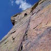 Near the top of the last pitch. The traverse left, then moving back right over the bulge, and then back left again to the top is wild but relatively easy at about 5.8.