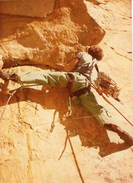 Chuck leading the  1st ascent of the very steep crux roof on the 2nd pitch. Double ropes would have been nice as turning the roof meant running your rope across a razor edged lip.