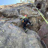 Climbing partner Case working to figure out the footwork required on this tough classic Interstate Park route.