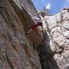Christa Cline turning the roof.  More difficult moves await on the upper headwall.
