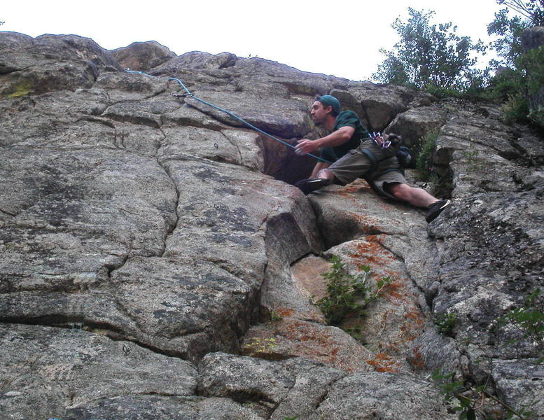 Jason Shatek contemplating the exit from the alcove.  The airy crux moves are ahead.