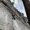 Fiddling with gear after the crux on a very crowded Saturday (see if you can spot everyone on the wall)