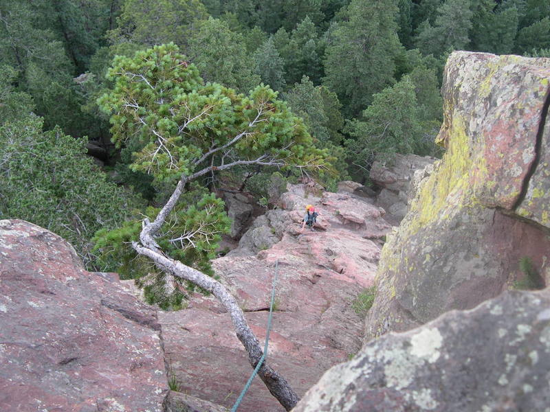 Paul heading up the first pitch, taken from the crux with the offending tree right in the middle!