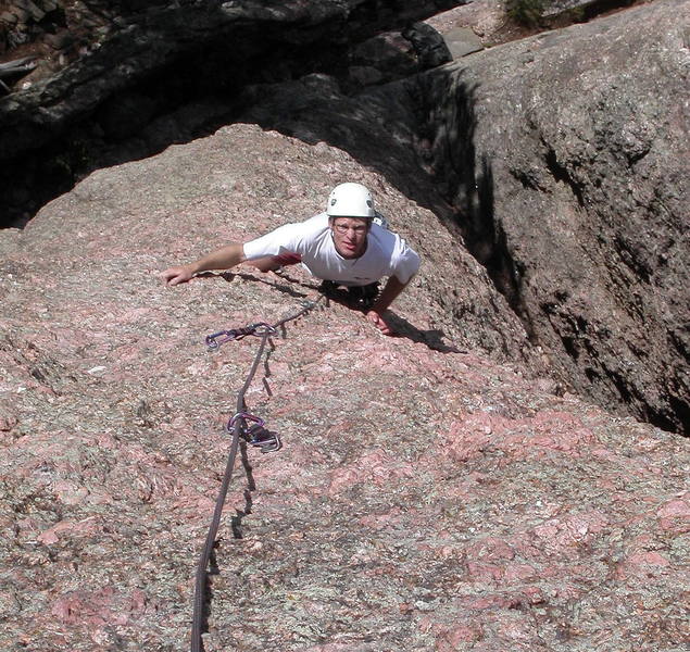 Albert Kettner contemplating the moves up the steep headwall near the top.